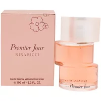 Nina Ricci Premier Jour Eau De Parfum 100ml, pink bottle with a frosted cap, beside a matching pink box with floral design.