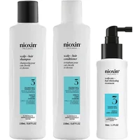 Nioxin System 3 Trial Kit with white bottles, teal labels; includes shampoo, conditioner, and leave-in treatment.