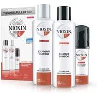 Nioxin System 4 Trial Kit with white bottles: shampoo, conditioner, and scalp treatment, in front of branded box.
