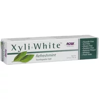 NOW Foods XyliWhite Refreshmint Toothpaste Gel, white box with green leaves and purple logo, 181g tube.