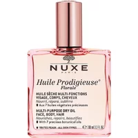 Pink glass bottle of Nuxe Huile Prodigieuse Florale 100ml, multi-purpose dry oil for face, body, hair with gold cap.