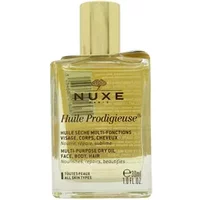 Clear glass bottle of Nuxe Huile Prodigieuse dry oil with gold cap, black text, and 30ml label.