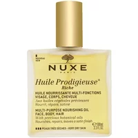 NUXE Huile Prodigieuse Riche oil in a square glass bottle with gold cap and black text on a light yellow label.
