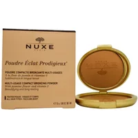 NUXE bronzing powder in gold compact with mirror, next to beige box with product details.