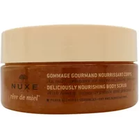 Nuxe Reve De Miel body scrub in a brown jar with a beige lid, featuring white text and elegant branding.