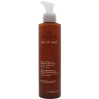 Amber bottle of Nuxe Reve De Miel Facial Cleansing Gel with white pump dispenser and brown label.
