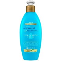 OGX Argan Oil Tame & Shine Cream in a blue 177 ml bottle with a white pump and gold label accents.