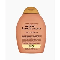 OGX® Brazilian Keratin Smooth Shampoo 385ml in a peach bottle with a gold flip cap and black text.