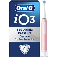 Pink Oral B iO 3 electric toothbrush with white accents, next to blue box with pressure sensor feature.