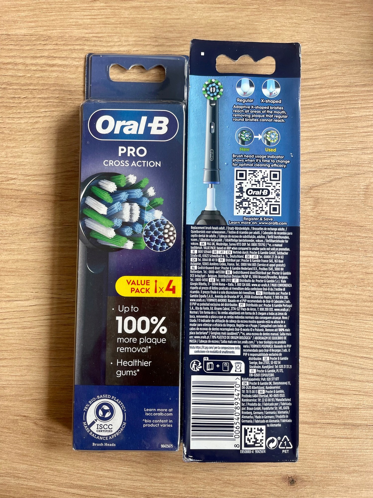 Black Oral-B Pro Cross Action toothbrush heads packaging featuring four replacement heads, with colorful bristles and detailed product information on the back.