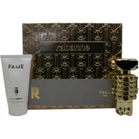 Paco Rabanne Fame Intense gift set with gold robot-shaped perfume bottle and white body lotion tube.