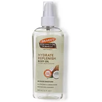 Clear bottle of Palmer's Coconut Oil Body Oil with Vitamin E, 150ml, featuring a spray nozzle and coconut imagery.