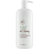 White Paul Mitchell Tea Tree Scalp Care Anti-Thinning Conditioner bottle with pump, 1000ml, green and brown text.