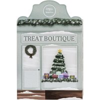 Paul Mitchell Tea Tree Special Gift Set in festive box with wreath, Christmas tree, and snow accents.
