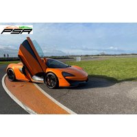 Orange McLaren 570s supercar with butterfly doors open on a racetrack, PSR Experience logo in the corner.