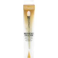 Gold Real Techniques concealer brush with a triangular head, packaged in a clear box with gold accents.