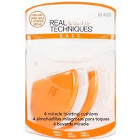 Orange Real Techniques Miracle Blotting Cushions in clear packaging, featuring four crescent-shaped sponges.