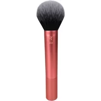 Pink Real Techniques Powder Brush with a wide, fluffy black bristle head and sleek metallic handle.