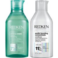 Green Redken Amino Mint Shampoo bottle and white Acidic Bonding Concentrate Conditioner bottle with holographic label.