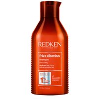 Red bottle of Redken Frizz Dismiss Shampoo 300ml with orange cap and white text detailing anti-frizz benefits.