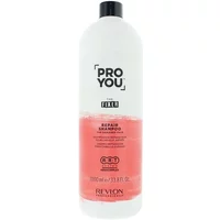 Revlon Pro You The Fixer Repair Shampoo 1000ml, white bottle with pink label and black cap.