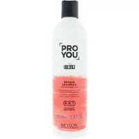 White Revlon Pro You The Fixer Repair Shampoo bottle, 350ml, with black cap and pink label detailing.