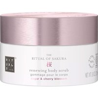 White Rituals Sakura Renewing Body Scrub jar with pink lid, featuring cherry blossom design and text in black and pink.