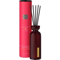 Red Rituals Ayurveda fragrance sticks in a dark red bottle with black reeds, next to a matching red cylindrical box.