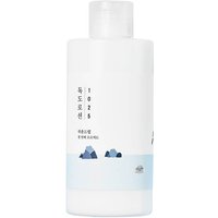 Round Lab 1025 Dokdo Lotion, white bottle with blue mountain design, 200 ml moisturizing face lotion.