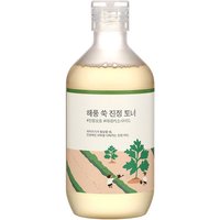 Round Lab Mugwort Calming Toner 300 ml in clear bottle with green label and landscape illustration.