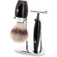 Mühle Kosmo safety razor kit with black handle, silver razor, matching brush, and chrome stand.