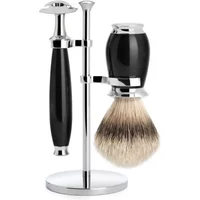 Black and chrome safety razor kit with brush and stand, featuring sleek handles and polished metal accents.