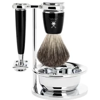 Mühle Rytmo Pur safety razor kit with black handle, chrome stand, shaving brush, and bowl.
