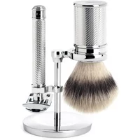 Chrome-plated safety razor kit with textured handle, shaving brush, and stand by Mühle.