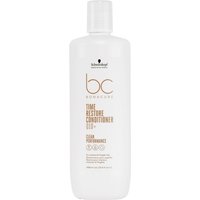 White bottle of Schwarzkopf BC Bonacure Time Restore Conditioner with gold text and black logo.