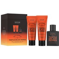 Scottish Fine Soaps gift set with orange tubes and black bottle, labeled Thistle & Black Pepper.