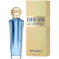 Blue Shakira Dream Eau De Toilette 80ml bottle with gold cap, next to cream and gold box with "Dream" text.