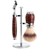 Shaving kit with ebonite handle razor, matching brush, and chrome stand.