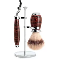 Shaving kit with ebonite handle, chrome stand, Mach3 razor, and synthetic brush by Mühle.