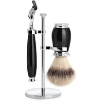 Black and chrome Mühle Fusion shaving kit with razor, brush, and stand.