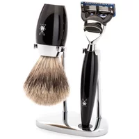 Black and chrome Mühle shaving kit with brush and Fusion razor on a sleek stand.
