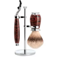 Shaving kit with ebonite handle, chrome stand, Mach3 razor, and synthetic brush by Mühle.