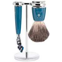 Shaving kit with blue handle razor, matching brush, and chrome stand, featuring Mühle Rytmo Fusion Pur design.