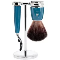 Blue Mühle Rytmo Mach3 shaving kit with brush and razor on a chrome stand.