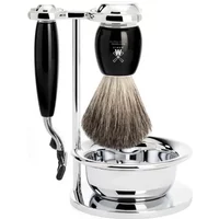 Shaving kit with black-handled razor, badger brush, chrome stand, and bowl by Mühle.