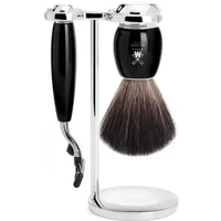 Black and chrome Mühle Vivo Mach3 shaving kit with brush and razor on a sleek stand.