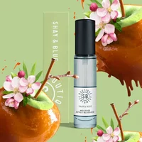 Shay & Blue Melrose Apple Blossom Eau De Parfum 10ml, clear glass bottle with black cap, floral and apple graphics.