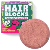 Shower Blocks solid shampoo, pink round bar, mint and grapefruit scent, colorful packaging with playful design.