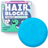 Peppermint Shower Blocks solid shampoo, bright blue round bar with playful packaging featuring cartoon character.