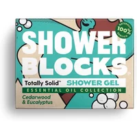 Shower Blocks solid shower gel in teal and cream packaging with cedarwood and eucalyptus essential oil collection label.